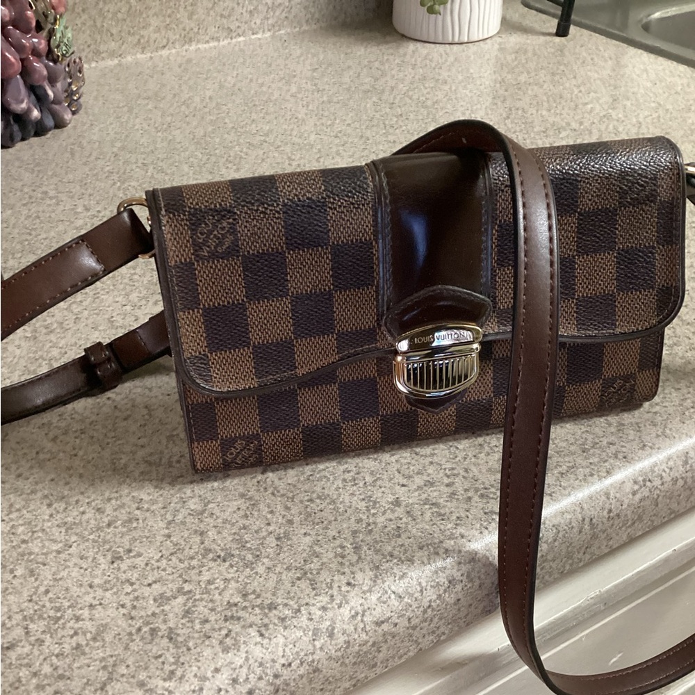 Authentic Louis Vuitton Damier wallet with strap.
